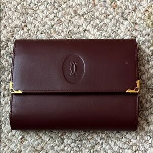 Authentic Cartier Burgundy Leather Wallet with Gold Accents